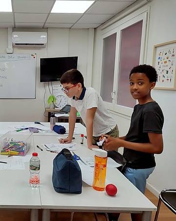 A small group activity in a summer Spanish class
