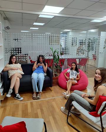 Students relaxing in the common room between classes