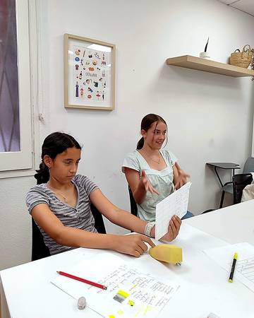 Teenagers working on a speaking activity in Spanish