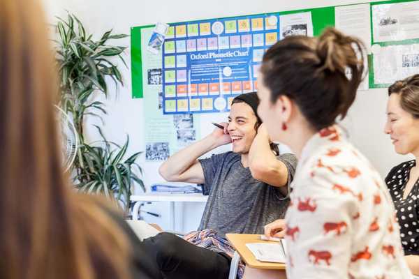 Small group laughing in a Semi-Intensive Spanish class